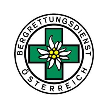 Ein Logo des Bergrettungsdienstes Österreich. Es zeigt ein grünes Kreuz mit einer Alpenblume in der Mitte. | © Bergrettung Mittelberg Hirschegg Logo