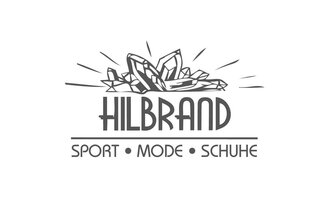 © Sport Hilbrand OG Logo Das Logo von Hilbrand zeigt stilisierte Kristalle über dem Schriftzug. Der Text betont die Kategorien Sport, Mode und Schuhe. | © Sport Hilbrand OG Logo