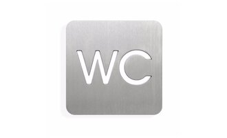 A simple, metallic sign with the inscription "WC". It indicates that there is a toilet nearby.